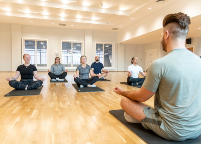 Group yoga class with instructor
